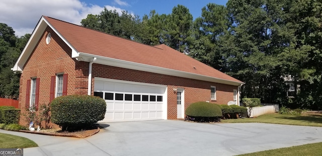 view of property exterior featuring a garage