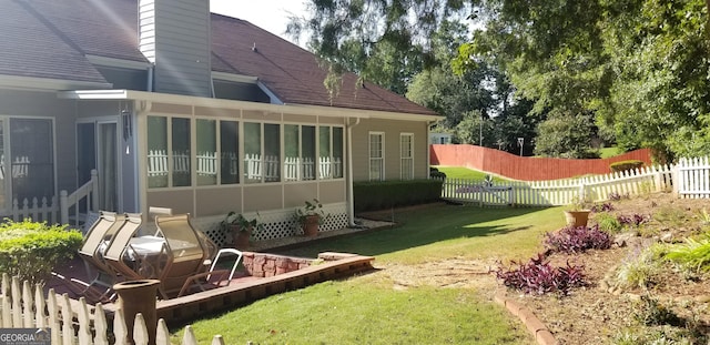 view of yard featuring a sunroom