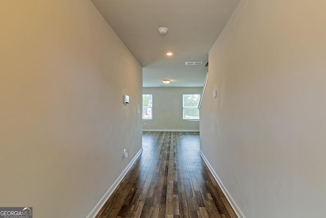 hall with dark wood-type flooring