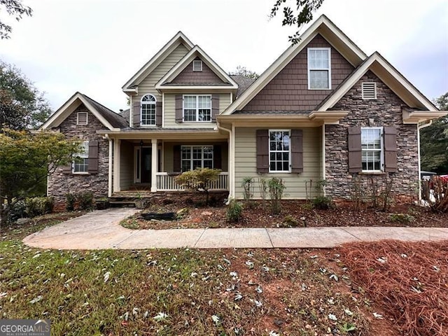 craftsman inspired home featuring covered porch