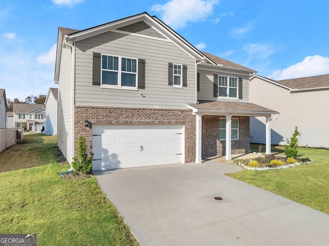 view of front of property featuring a garage and a front yard