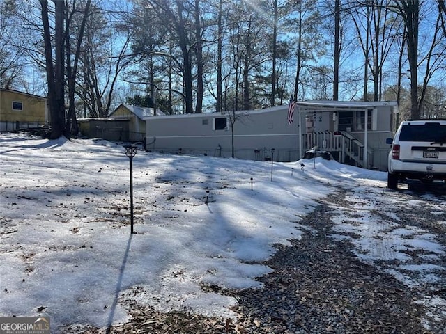 view of yard layered in snow