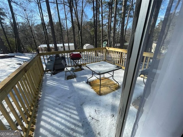 view of snow covered deck