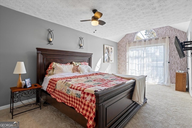 carpeted bedroom featuring ceiling fan, lofted ceiling, access to exterior, and a textured ceiling