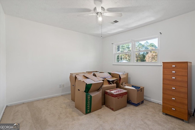 interior space with ceiling fan