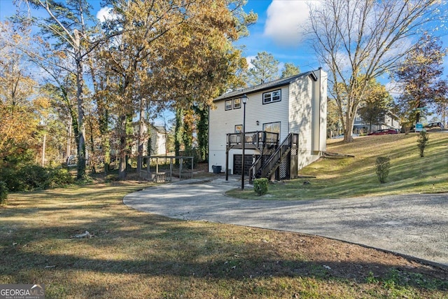 exterior space featuring a yard and a deck