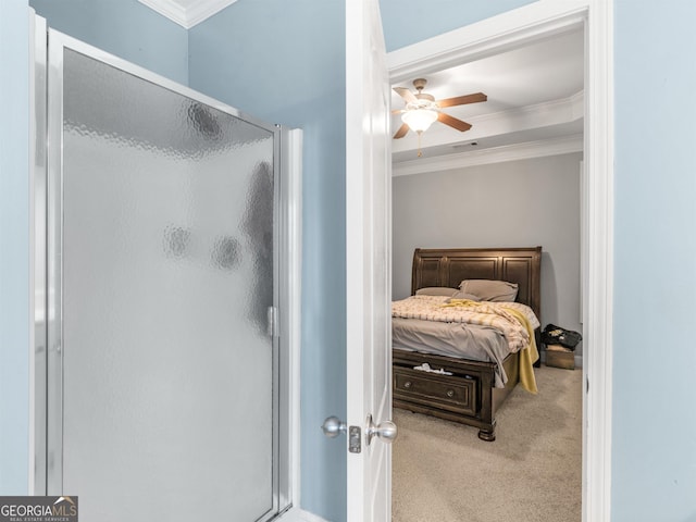 bedroom featuring light carpet, crown molding, and ceiling fan