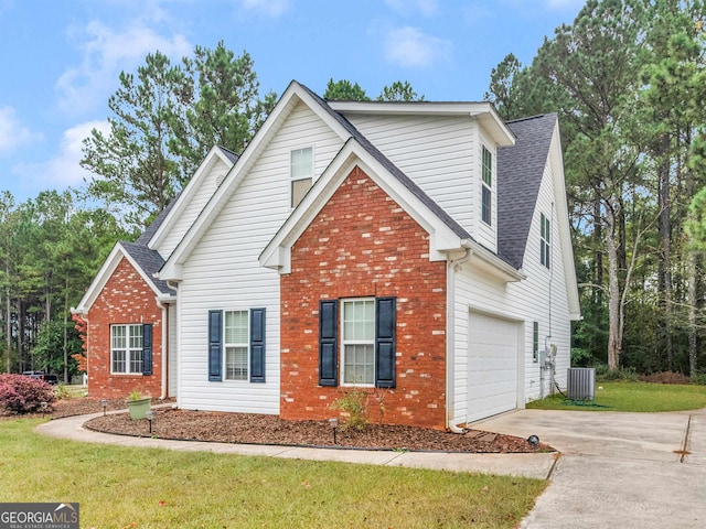 front facade featuring a garage, central AC, and a front lawn