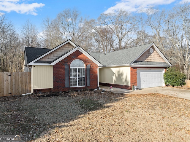 view of front of home featuring a garage and a front lawn