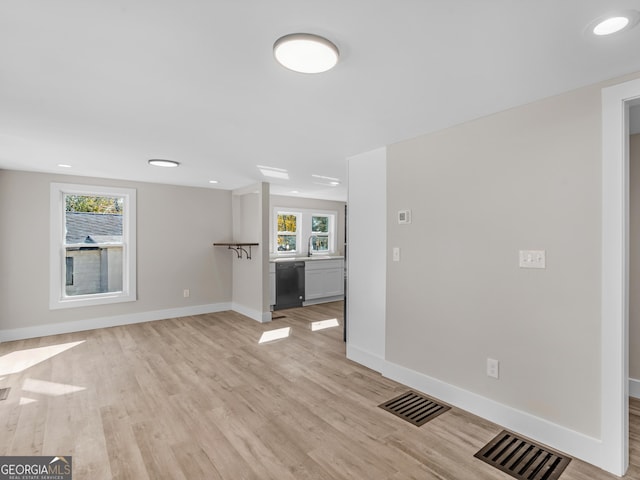 unfurnished living room with light hardwood / wood-style flooring