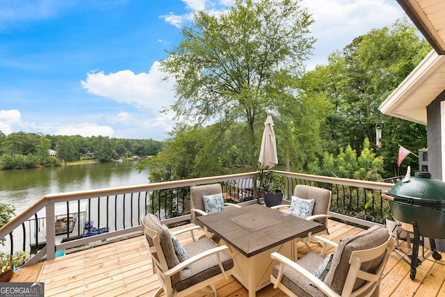 wooden deck with a water view