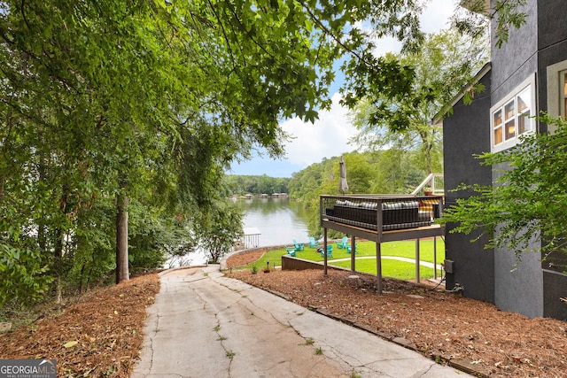 view of home's community with a water view