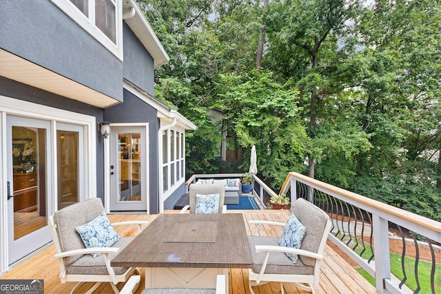 deck with an outdoor hangout area