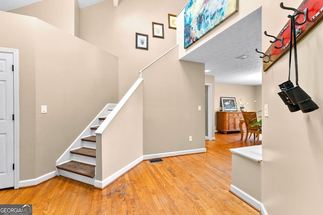 stairway featuring hardwood / wood-style flooring