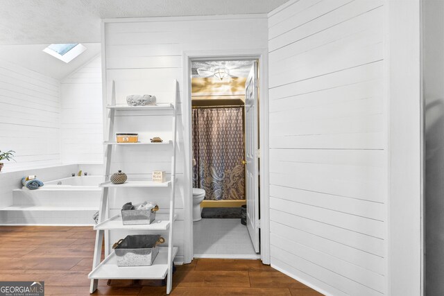 bedroom with french doors, ornamental molding, and wood-type flooring