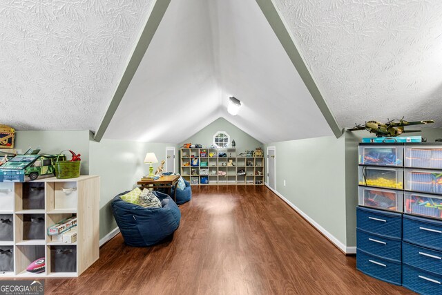 corridor with an inviting chandelier, lofted ceiling, and light hardwood / wood-style flooring