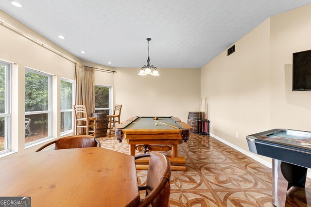 bedroom with dark hardwood / wood-style flooring, lofted ceiling, and a textured ceiling