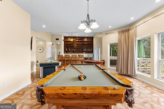 rec room with indoor bar, pool table, and a chandelier