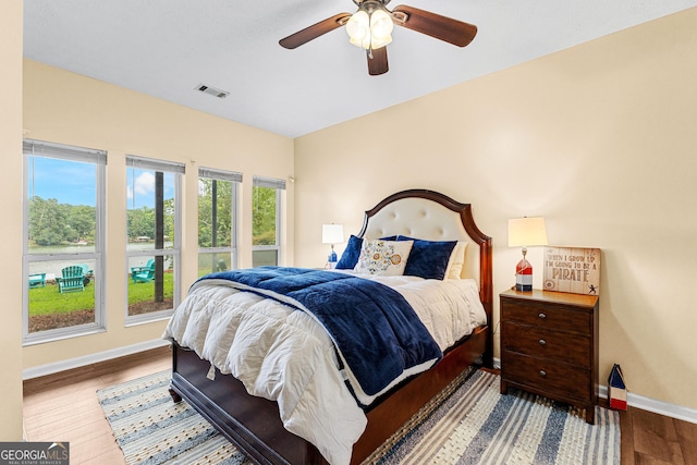 bedroom featuring hardwood / wood-style flooring and ceiling fan