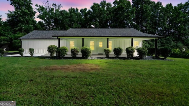 ranch-style house with a lawn