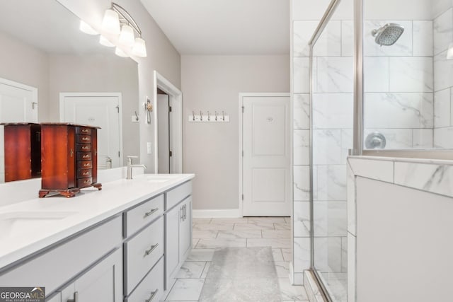 bathroom with vanity and a shower with door