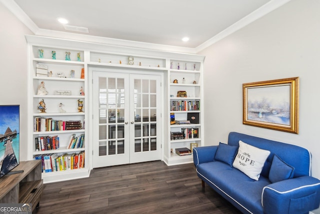 sitting room featuring french doors, dark hardwood / wood-style floors, built in features, and crown molding