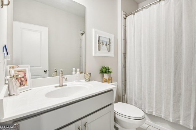 full bathroom featuring vanity, shower / tub combo, and toilet