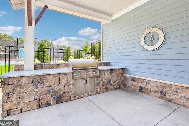 view of patio / terrace featuring an outdoor kitchen and area for grilling