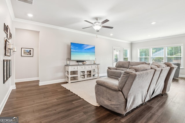 living room featuring crown molding, dark hardwood / wood-style floors, and ceiling fan