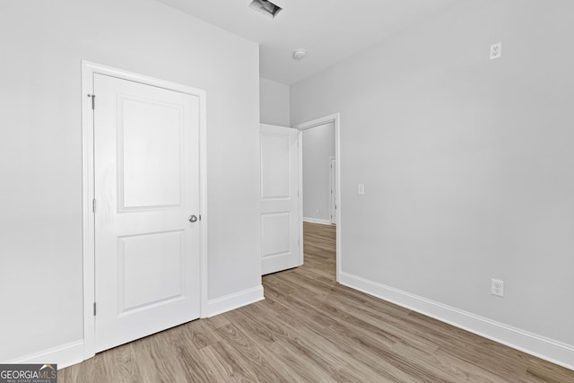 205 Lenox Cir, Lagrange, GA 30241 - unfurnished bedroom with light wood-type flooring, baseboards, and visible vents
