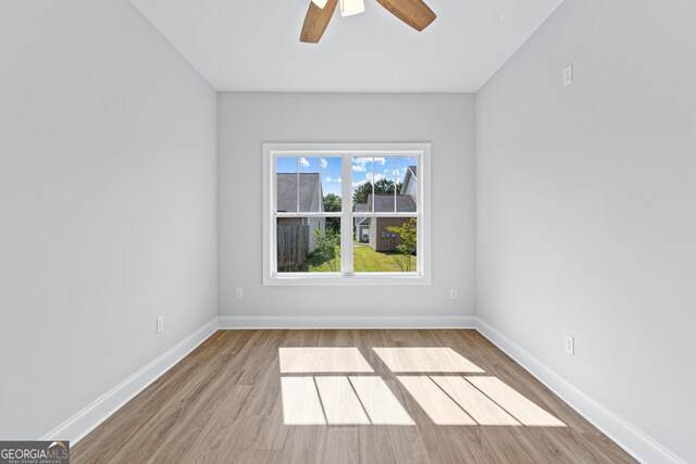 205 Lenox Cir, Lagrange, GA 30241 - spare room with baseboards, ceiling fan, and wood finished floors