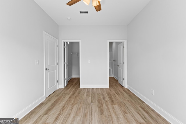 205 Lenox Cir, Lagrange, GA 30241 - unfurnished bedroom with light wood-style floors, visible vents, a closet, and a spacious closet