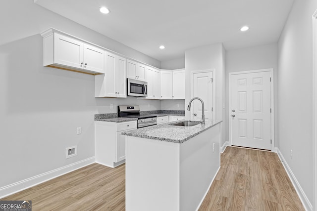 205 Lenox Cir, Lagrange, GA 30241 - kitchen with baseboards, a sink, dark wood-type flooring, and stainless steel appliances