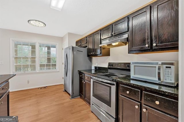 kitchen featuring stainless steel appliances, dark brown cabinetry, and light hardwood / wood-style floors