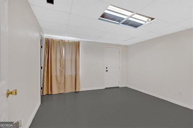 unfurnished room featuring a paneled ceiling