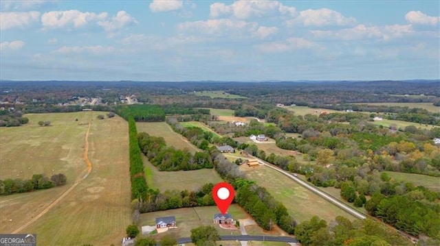 birds eye view of property featuring a rural view