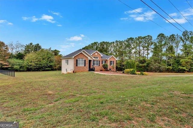 ranch-style house with a front lawn