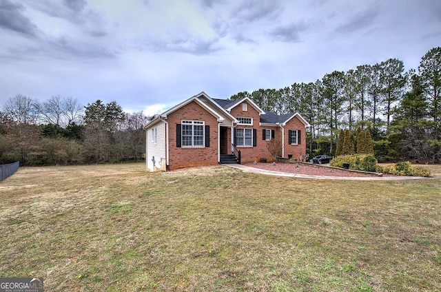 ranch-style house with brick siding and a front lawn