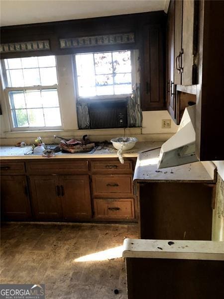 kitchen featuring dark brown cabinetry