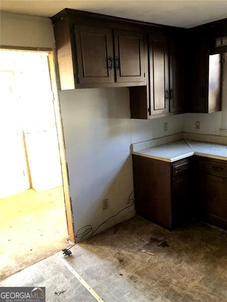 kitchen with dark brown cabinetry