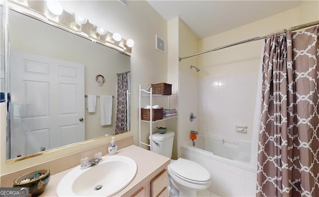 full bathroom with shower / bath combo, vanity, and toilet