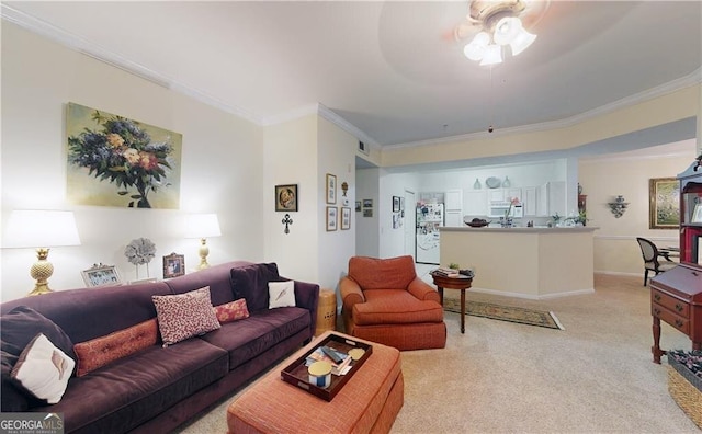 carpeted living room with crown molding and ceiling fan