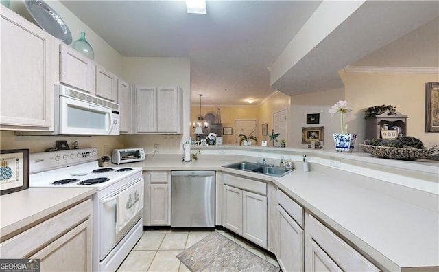 kitchen with sink, white cabinetry, light tile patterned floors, kitchen peninsula, and white appliances