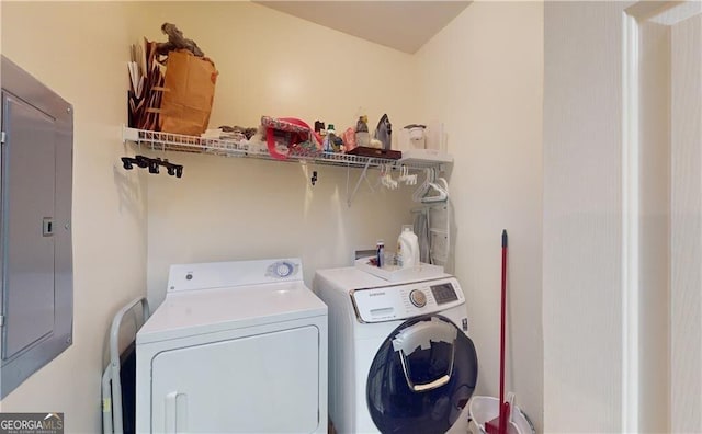 clothes washing area featuring washer and dryer and electric panel