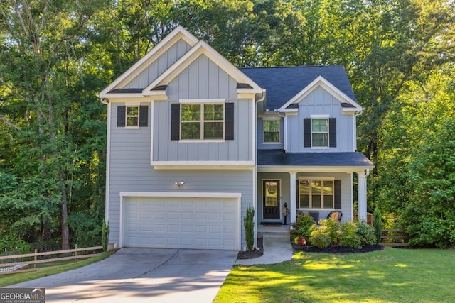 craftsman-style home featuring a garage and a front lawn