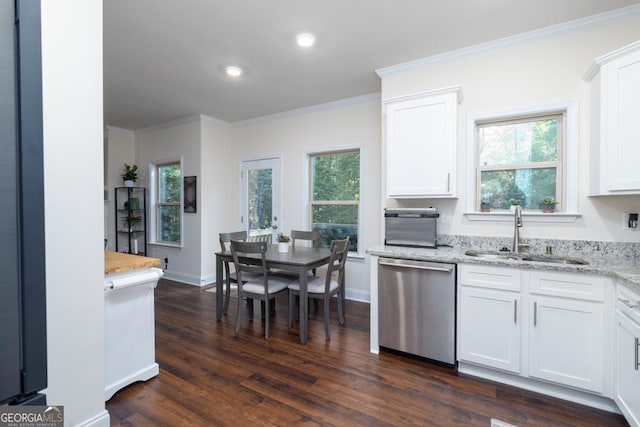 kitchen featuring dishwasher, sink, and white cabinets