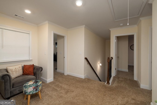 living area with ornamental molding and light colored carpet