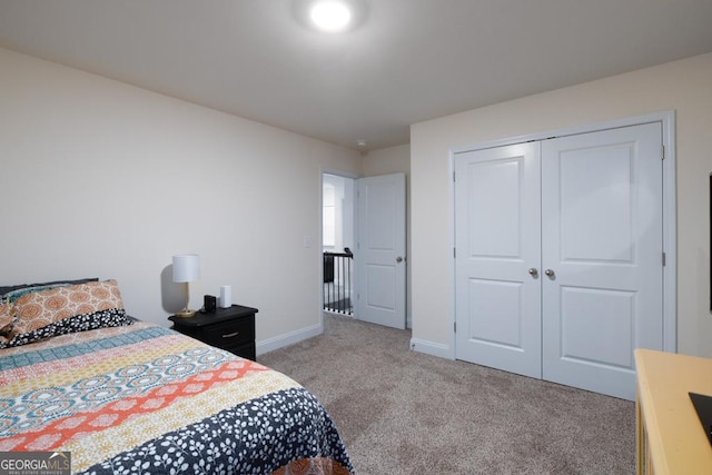 carpeted bedroom with a closet