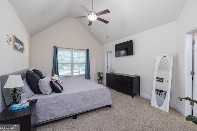 carpeted bedroom featuring vaulted ceiling and ceiling fan