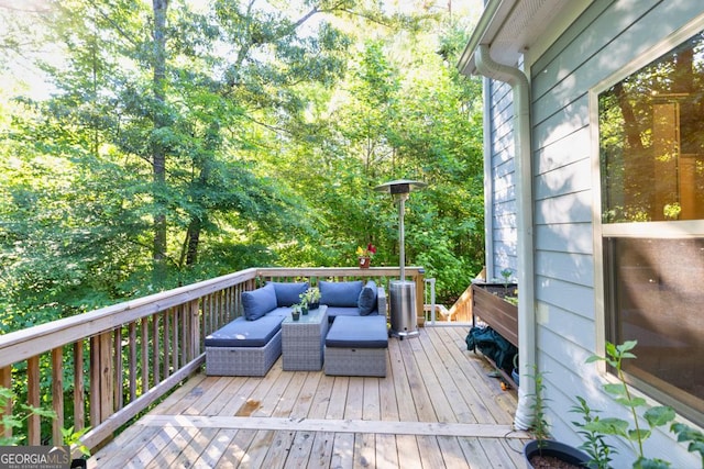 wooden deck featuring outdoor lounge area